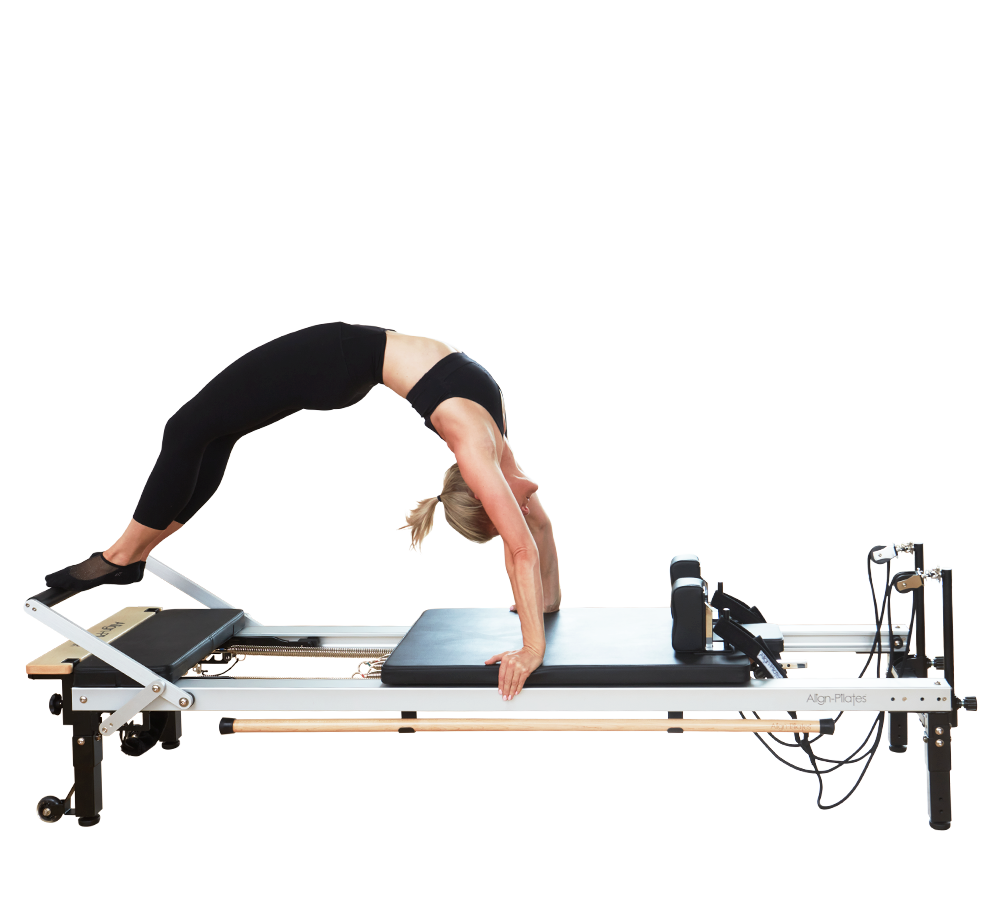 Pilates instructor on the Align-Pilates C8-Pro commercial reformer