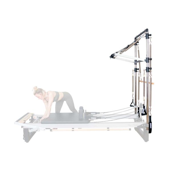 Pilates Teacher adjusts A8-Pro reformer springs