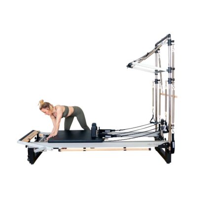 Pilates Teacher adjusts A8-Pro springs